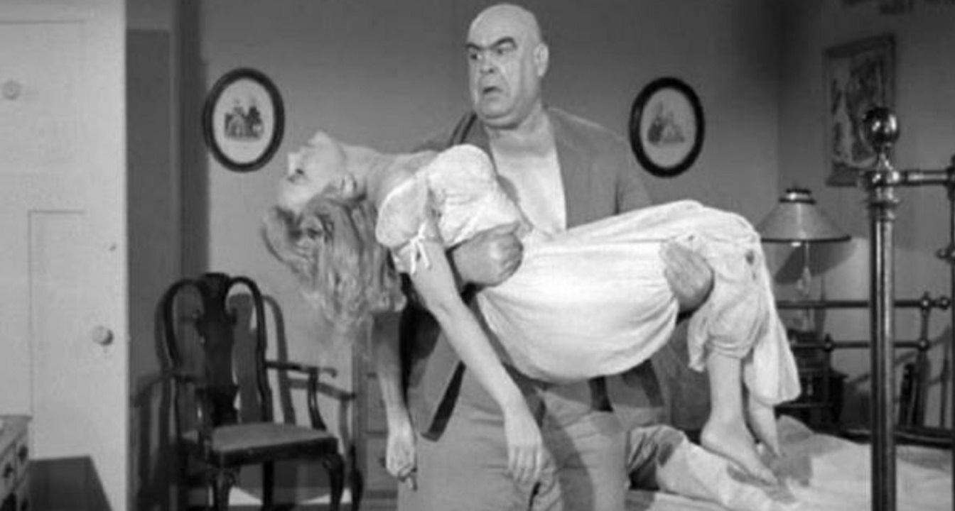 Lobo (Tor Johnson) carries off Sally Todd in The Unearthly (1957)