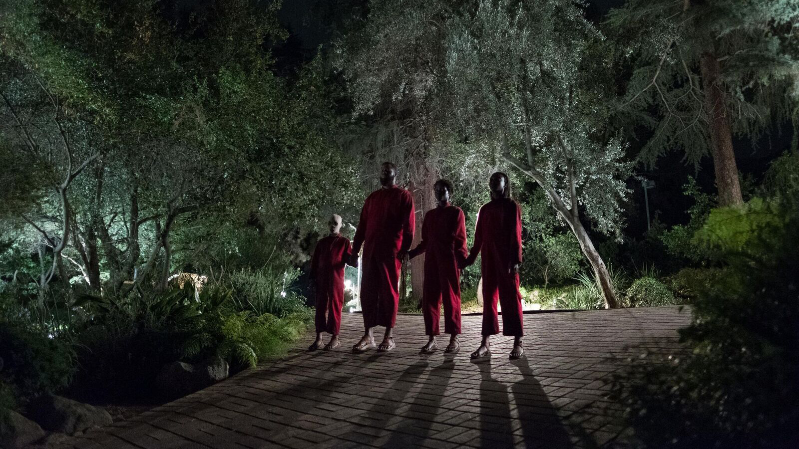 The doppelganger family waiting in the drive - (l to r) Evan Alex, Wilson Duke, Lupita Nyong’o and Shahadi Wright Joseph in Us (2019)