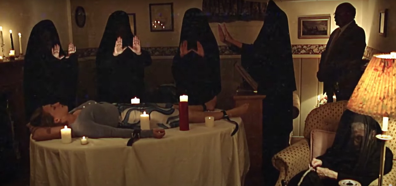 Cultists conduct a ritual at the hour of the millennium in the To Hell and Back episode of V/H/S/99 (2022)