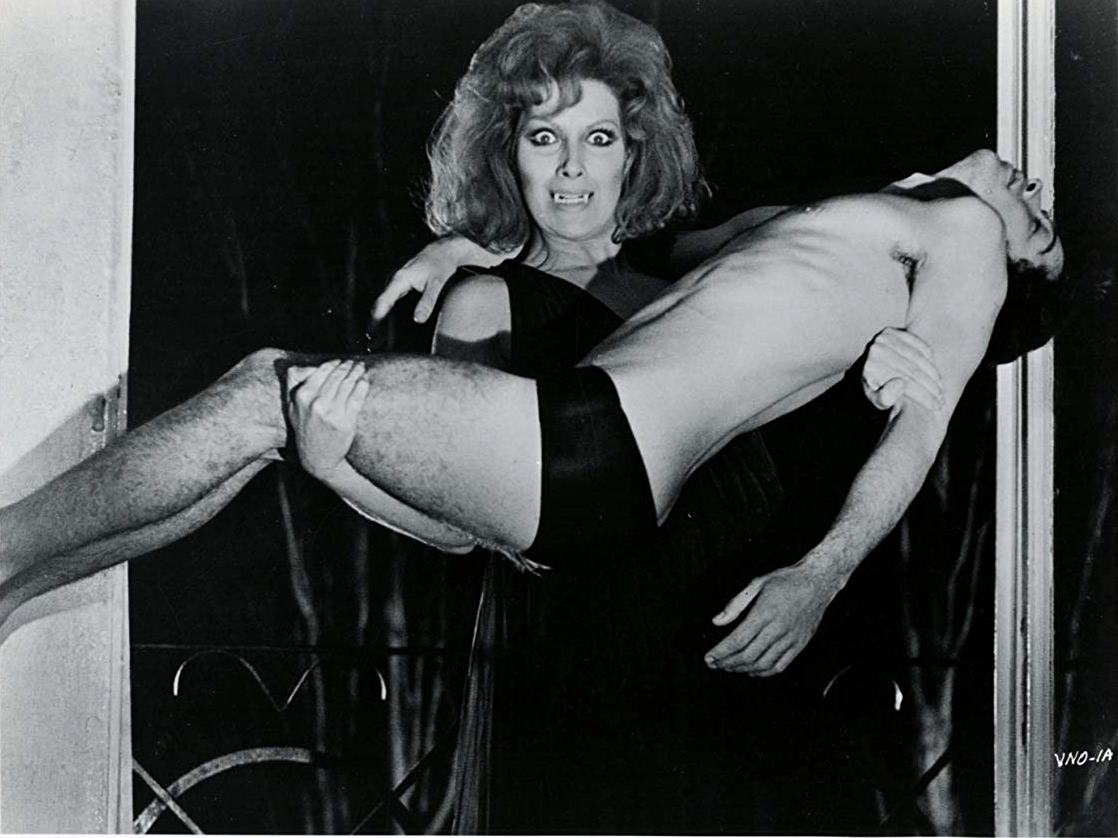 The Countess (Helga Line) and male victim in The Vampire's Night Orgy (1974)