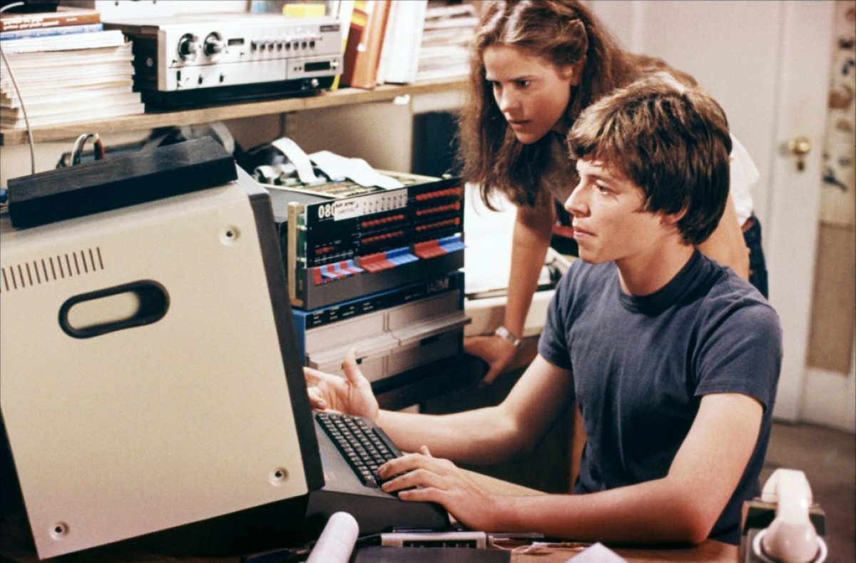 Matthew Broderick demonstrates his hacking skills to Ally Sheedy in WarGames (1983)