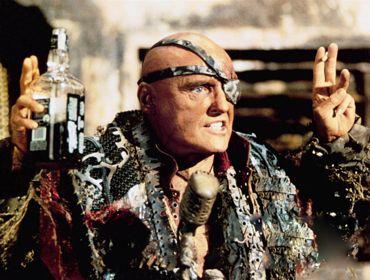 Dennis Hopper as The Deacon in Waterworld (1995)