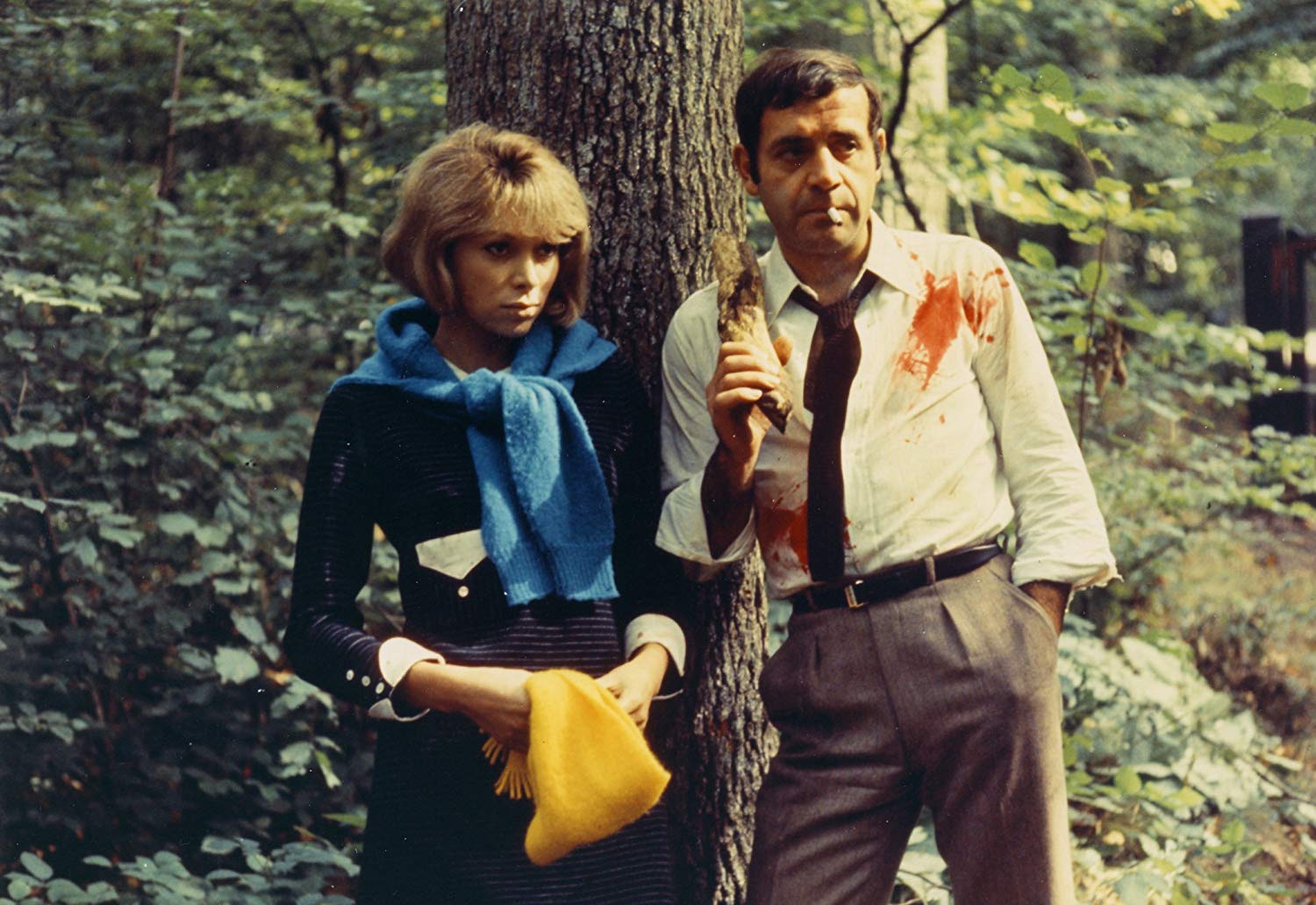 Husband and wife Jean Yanne and Mireille Darc on a weekend journey into the countryside in Weekend (1967)