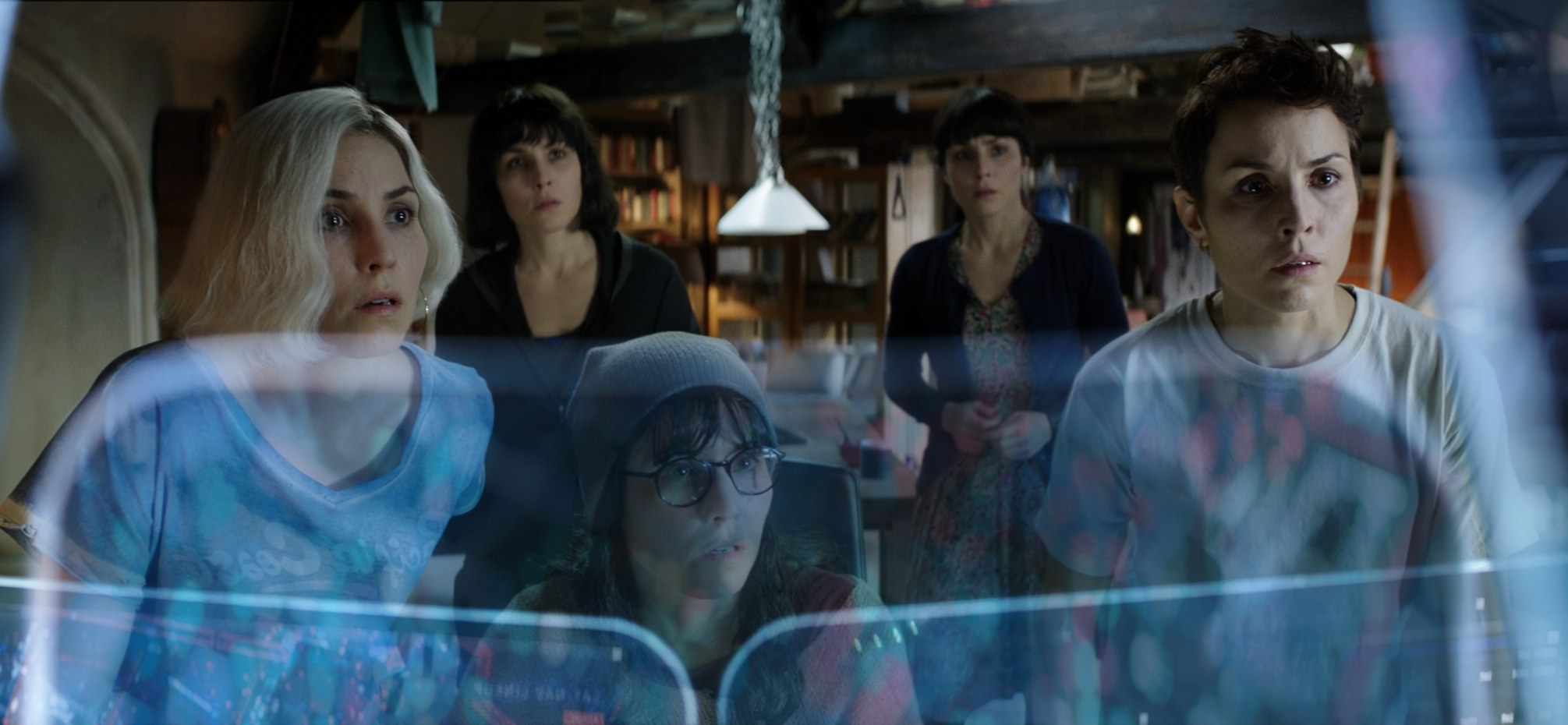 Noomi Rapace as five of the seven sisters as they set out to outwit the system in What Happened to Monday (2017)