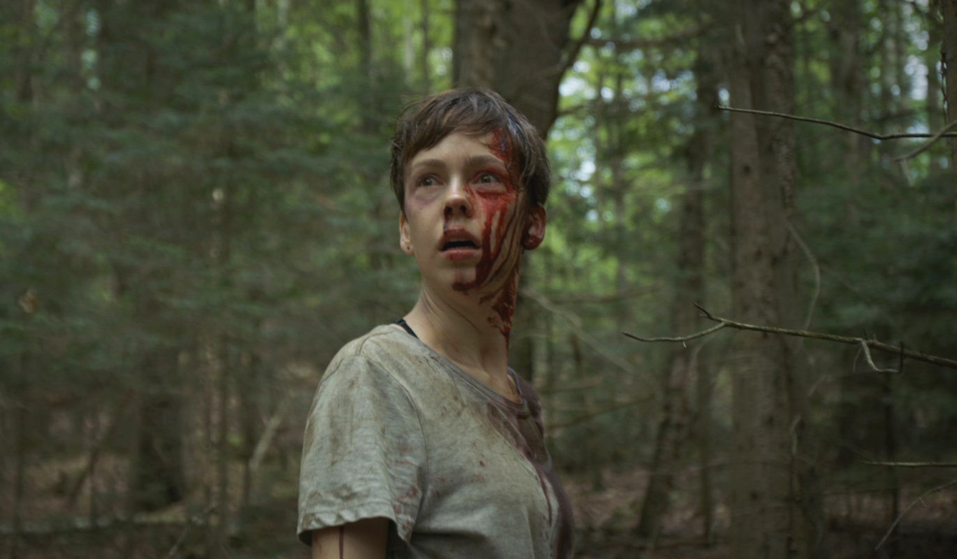 Brittany Allen hunted through the woods in What Keeps You Alive (2018)