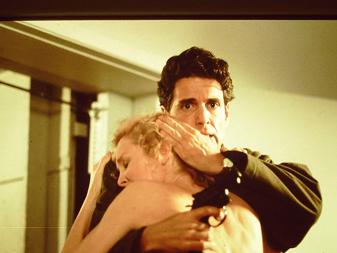 Police detective Chris Sarandon comforts writer Hilary Thomas (Victoria Tennant) in Whispers (1990)