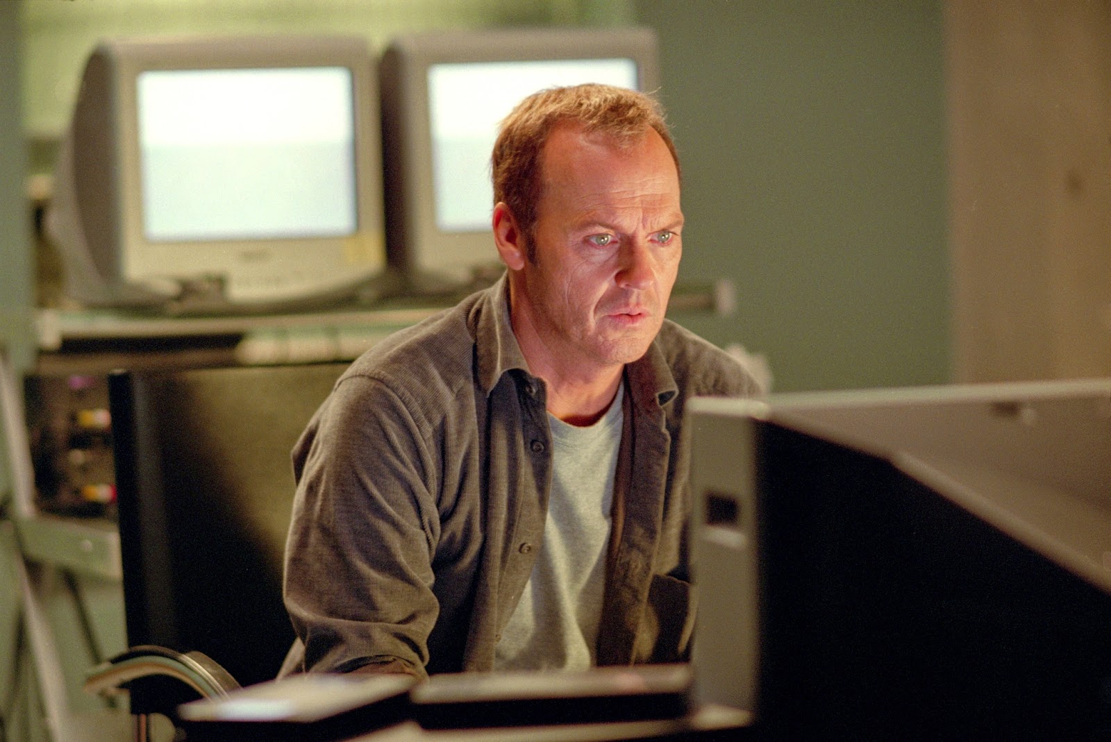 Widower Michael Keaton becomes obsessed with contacting his late wife via Electronic Voice Phenomenon in White Noise (2005)