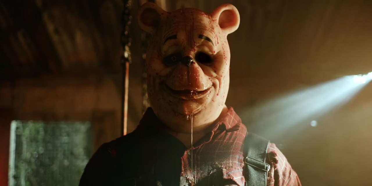 A murderous Winnie-the-Pooh (Craig David Dowsett) in Winnie-the-Pooh: Blood and Honey (2023)
