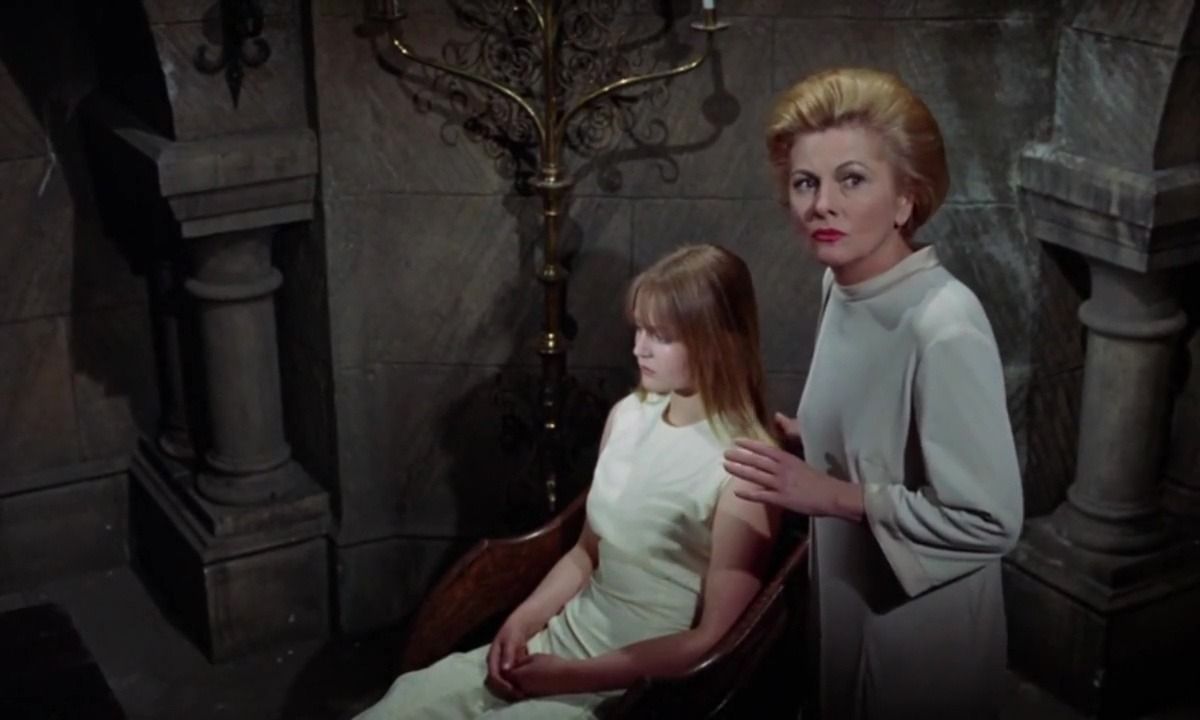 Schoolteacher Joan Fontaine (r) tries to save pupil Ingrid Brett (l) from The Witches (1966)