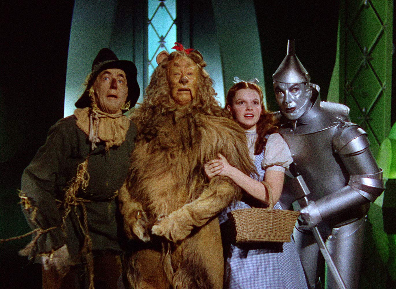 The Scarecrow (Ray Bolger), The Cowardly Lion (Bert Lahr), Dorothy (Judy Garland) and The Tin Woodsman (Jack Haley Sr) in The Wizard of Oz (1939)