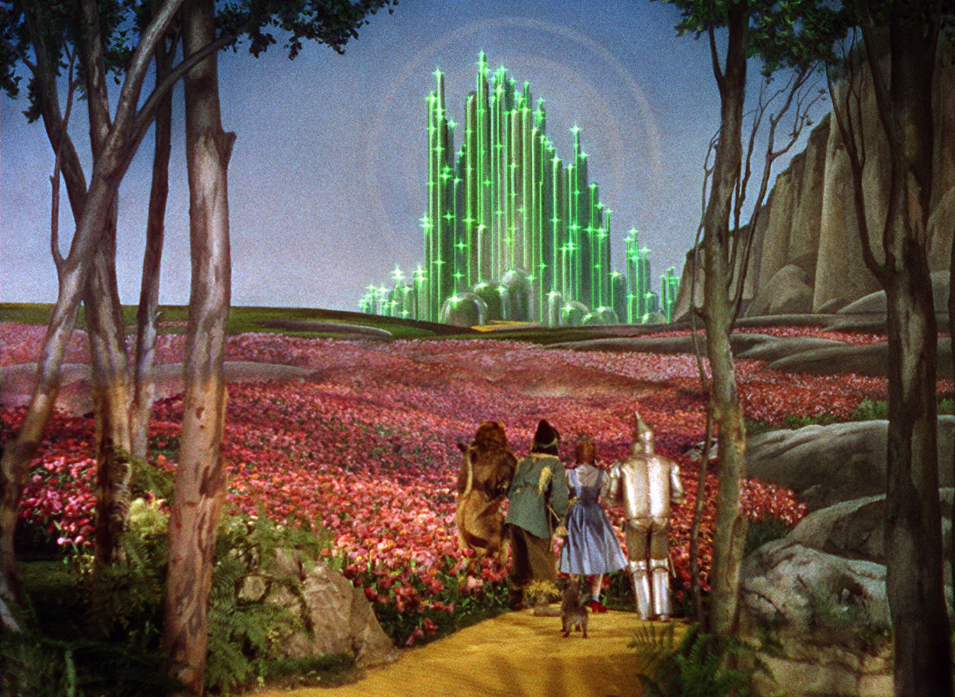 Dorothy and companions off down the Yellow Brick Road to the Emerald City of Oz in The Wizard of Oz (1939)