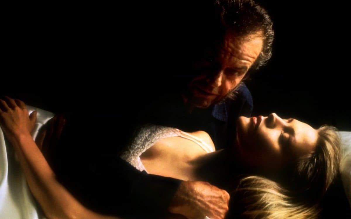 Jack Nicholson hovering over a sleeping Michelle Pfeiffer in Wolf (1994)