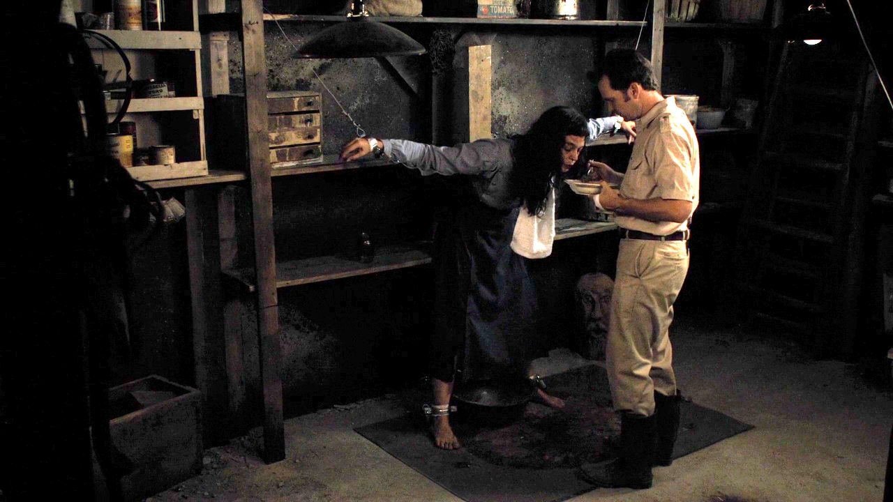 Sean Bridgers tends the imprisoned Pollyanna McIntosh in The Woman (2011)