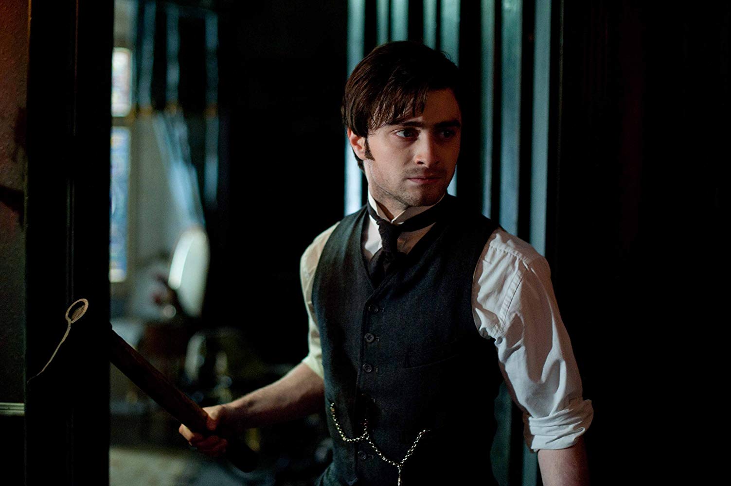 Arthur Kipps (Daniel Radcliffe) searches the house in The Woman in Black (2012)