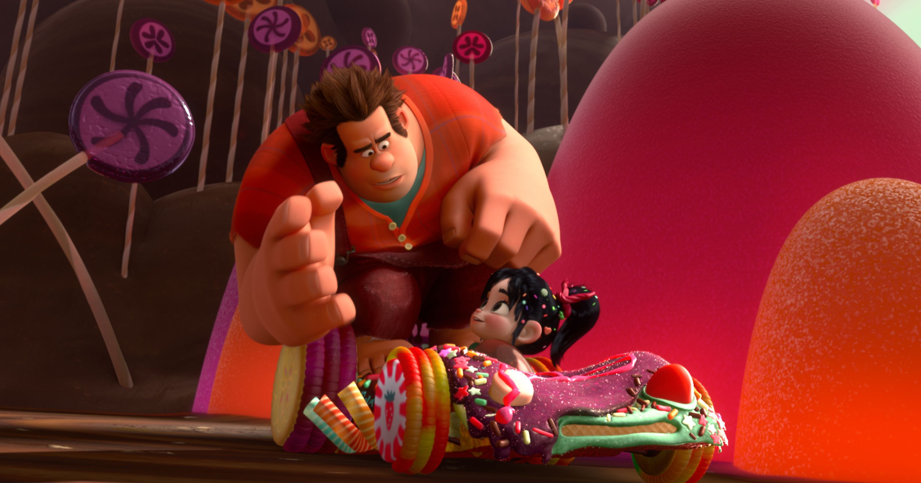 Wreck-It Ralph (voiced by John C. Reilly) and Vanellope von Schweetz (voiced by Sarah Silverman) in her candy racing car in Wreck-It Ralph (2012)