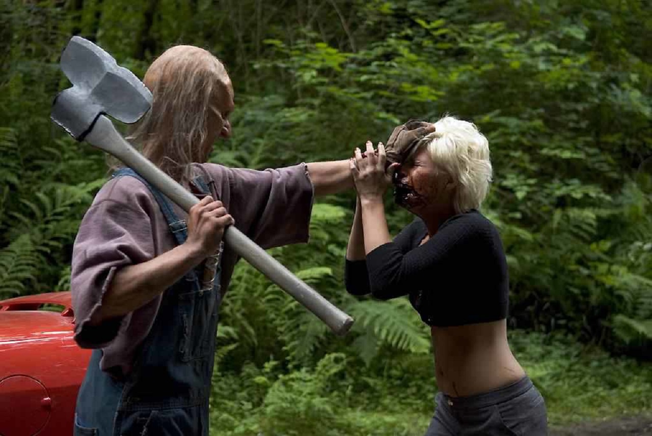 Three Finger (Jeff Scrutton) attacks Kimberly Caldwell in Wrong Turn 2: Dead End (2007)