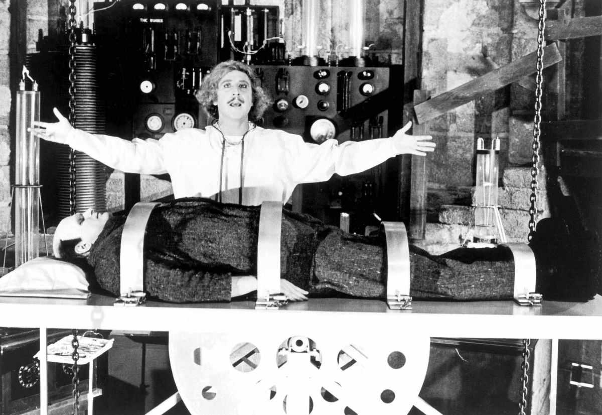 Frederick Frankenstein (Gene Wilder), the latest descendant of the family name, prepares to revive his monster (Peter Boyle) in Young Frankenstein (1974)