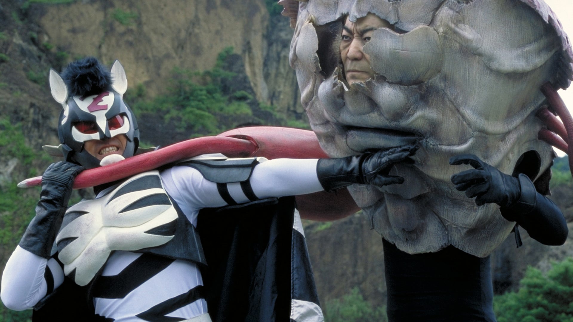 Zebraman (Sho Aikawa) kicks alien butt in Zebraman (2004)