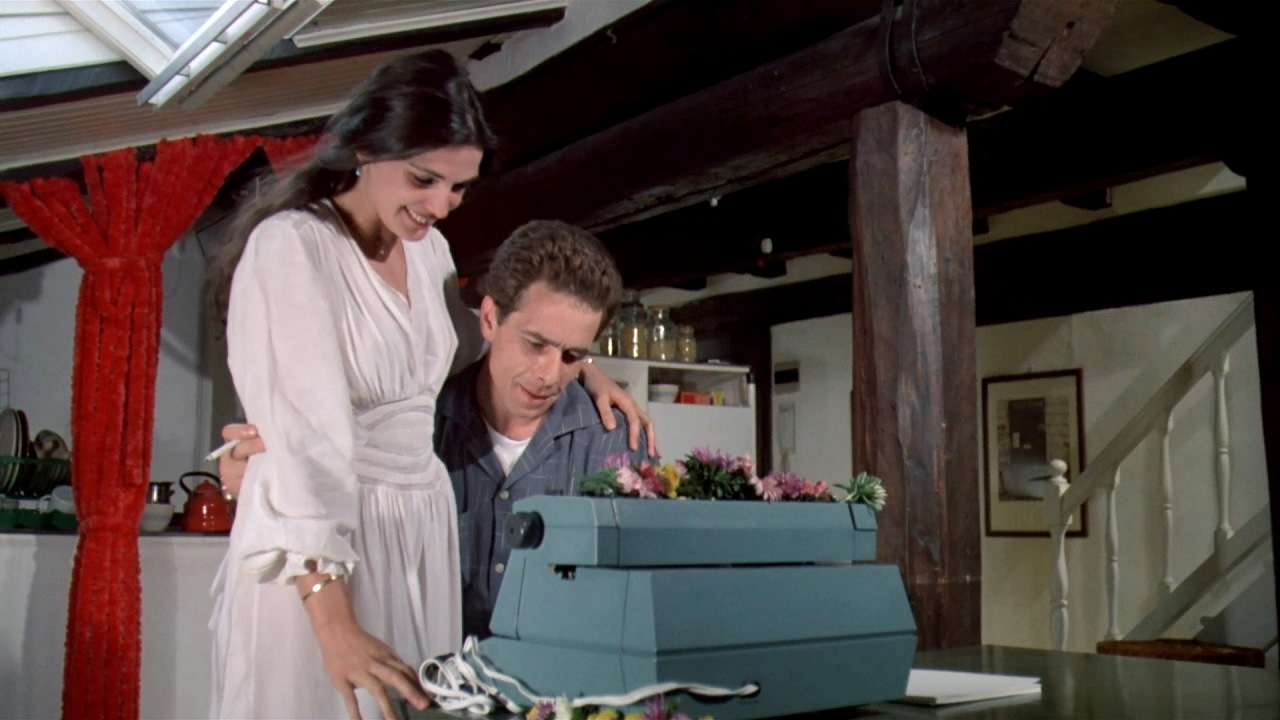 Anne Canovas and Gabriele Lavia with the electric typewriter in Zeder (1983)