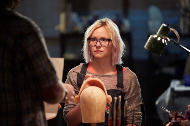 Alison Pill as the sex-doll factory worker lamenting her small breast size in Zoom (2015)