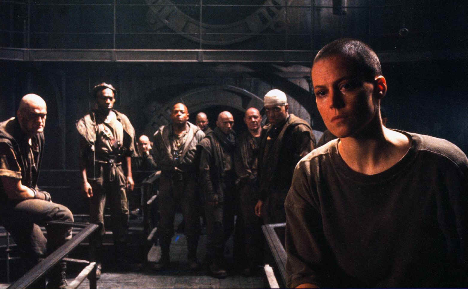 Ripley (Sigourney Weaver) (front right) and the prisoners of Fiorina 161 in Alien3 (1992)