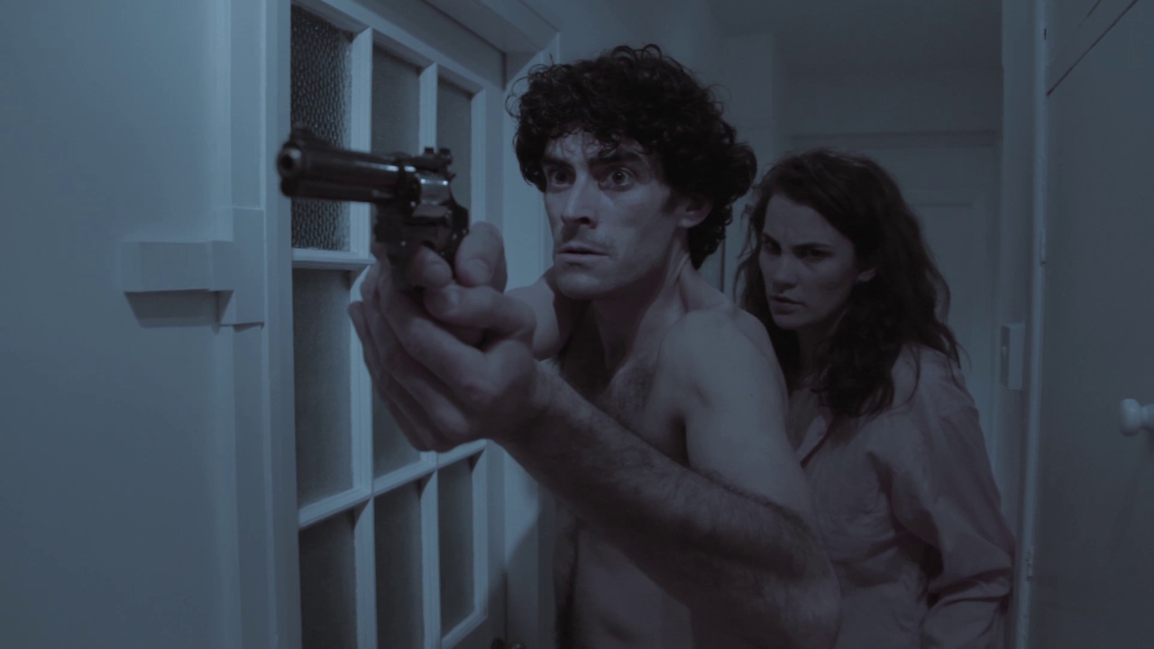 Toby Osmond and Hannah Dingle go to confront an intruder in the 6 Shooter episode of The 12 Slays of Christmas (2016)