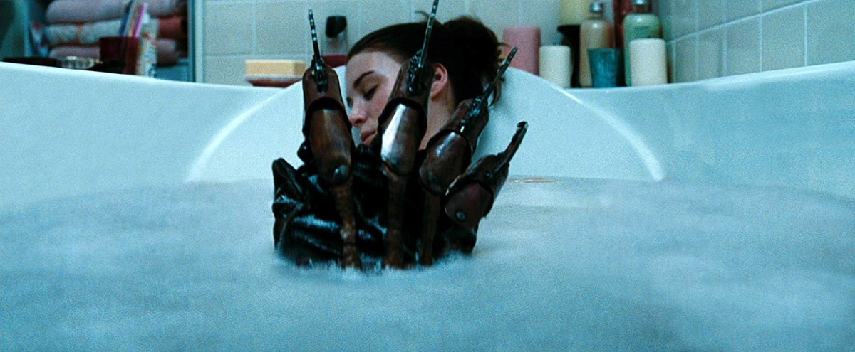 Freddy's claw appears in the bath as Nancy (Rooney Mara) sleeps in A Nightmare on Elm Street (2010)