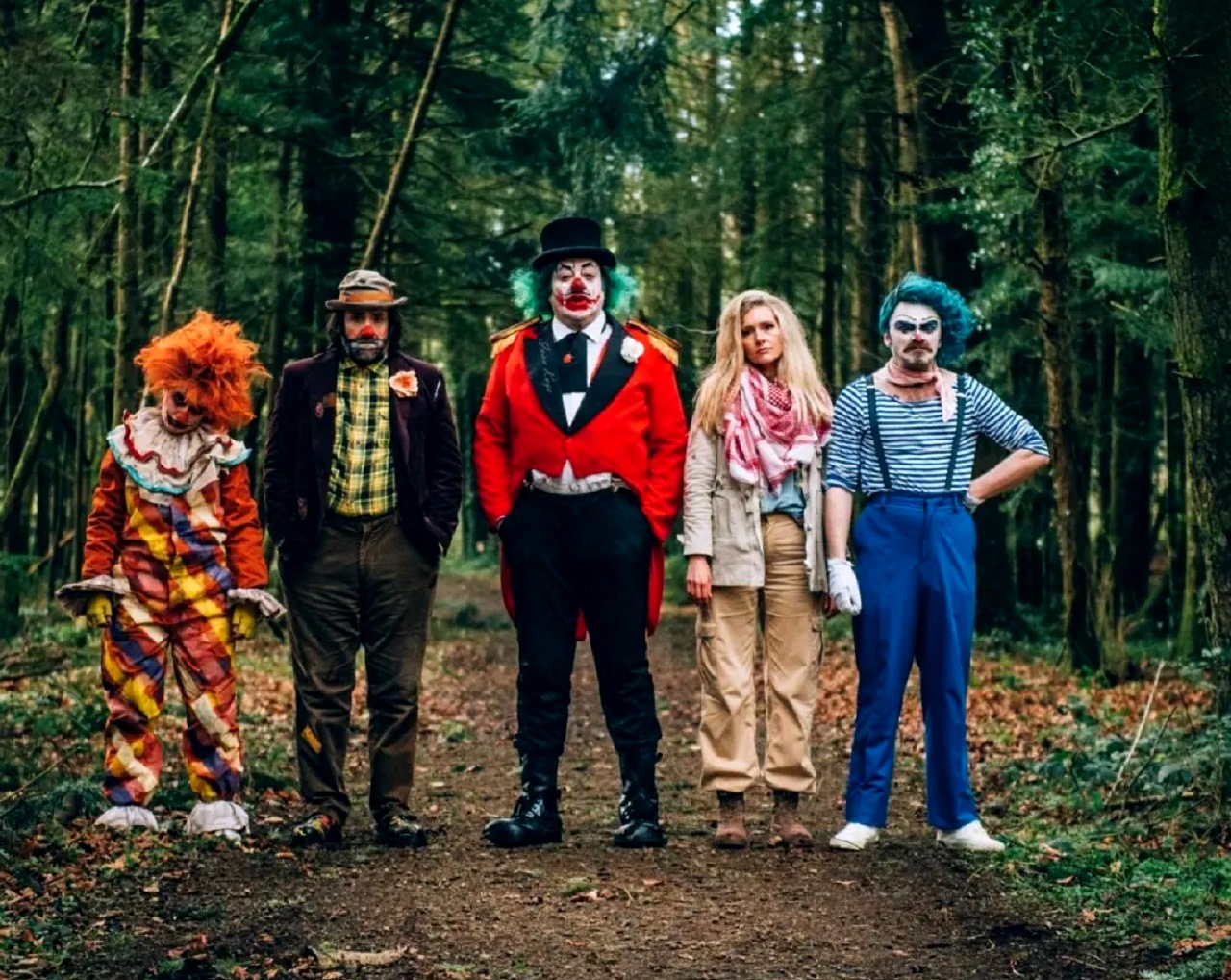 Clowns following the collapse of civilisation - Funzo (Natalie Palamides), Bobo (David Earl), The Great Alphonse (Ivan Kaye), Jenny (Amy De Bruhn) and Pepe (Fionn Foley) in Apocalypse Clown (2023)