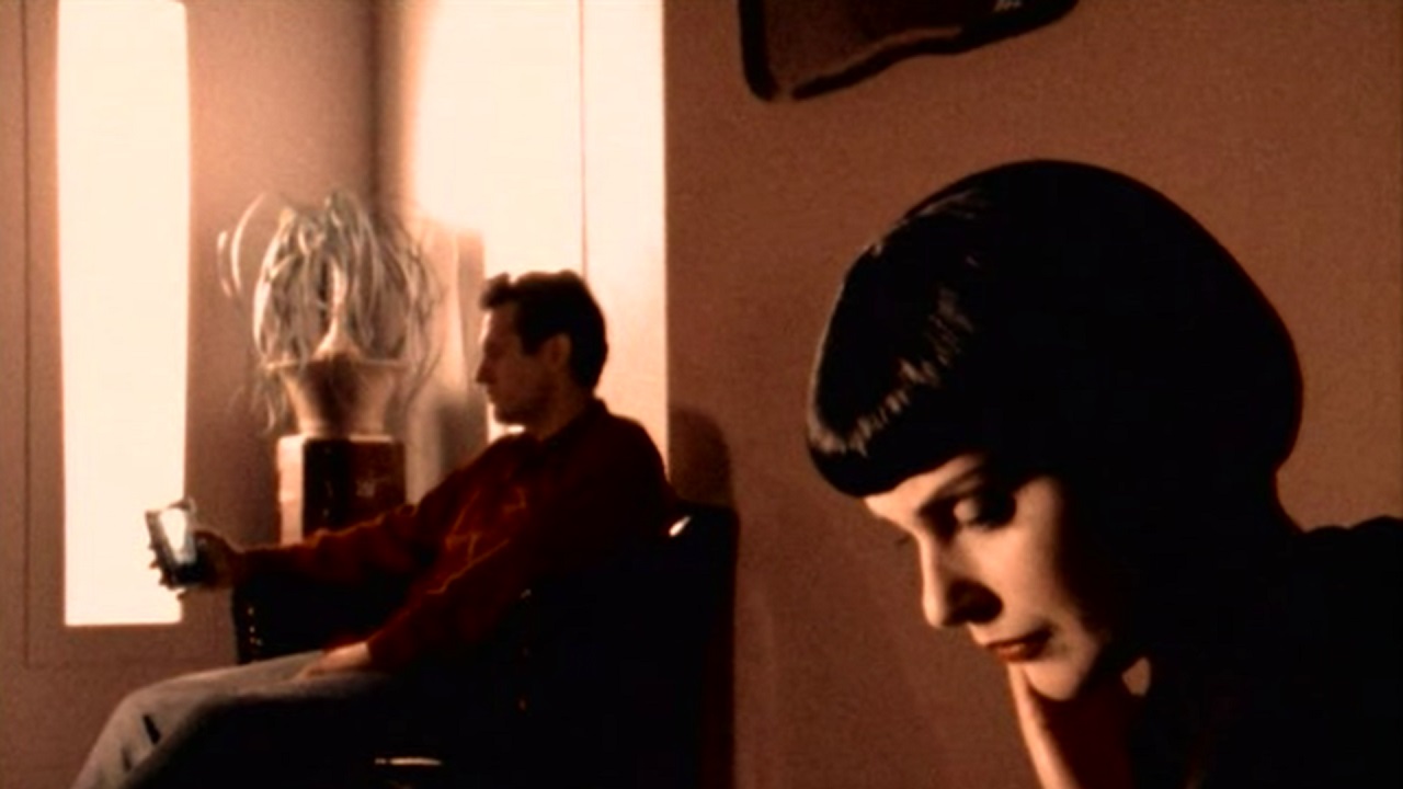 Karen Novotny (Anna Juvander) with Victor Slezak in the background in The Atrocity Exhibition (1998)