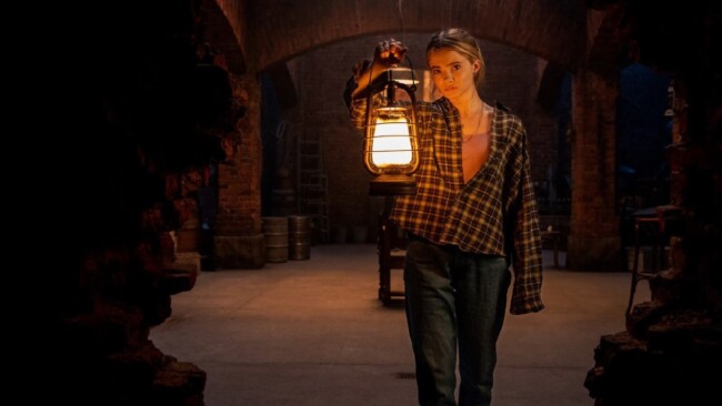 Freya Allen investigates the cellar in Baghead (2023)