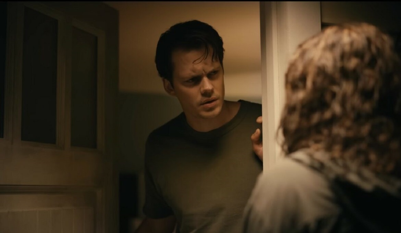 Bill Skarsgård answers the door to Georgina Campbell in Barbarian (2022)