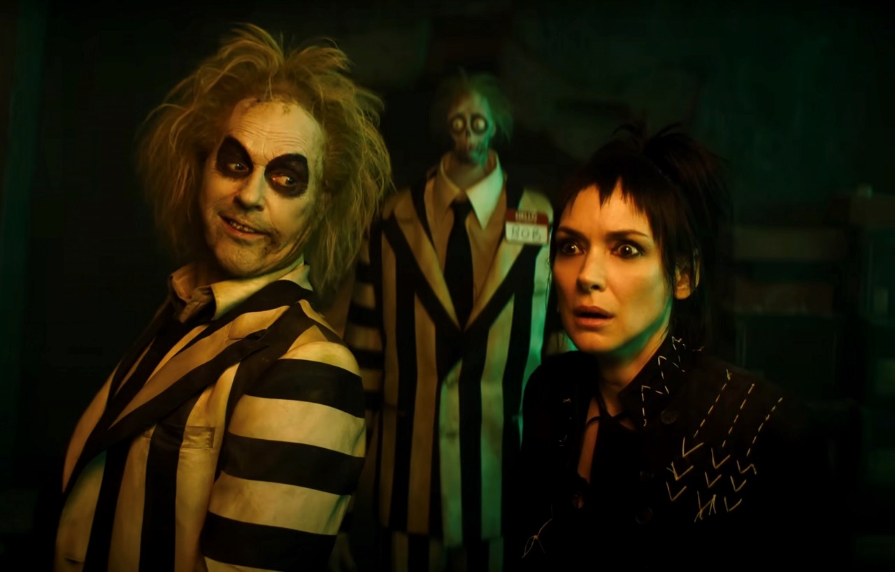 Beetlejuice (Michael Keaton) and Lydia Deetz (Winona Ryder) back again after 36 years in Beetlejuice Beetlejuice (2024) 1