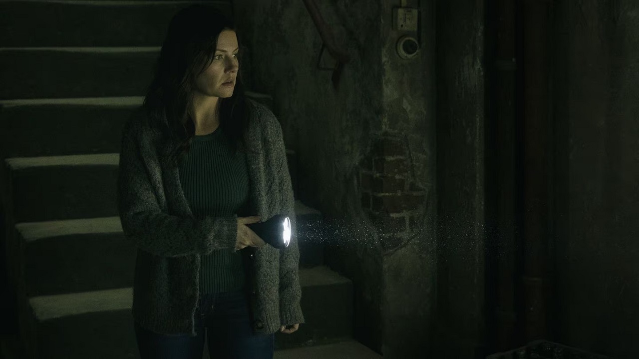 Elisha Cuthbert enters the cellar in The Cellar (2022)