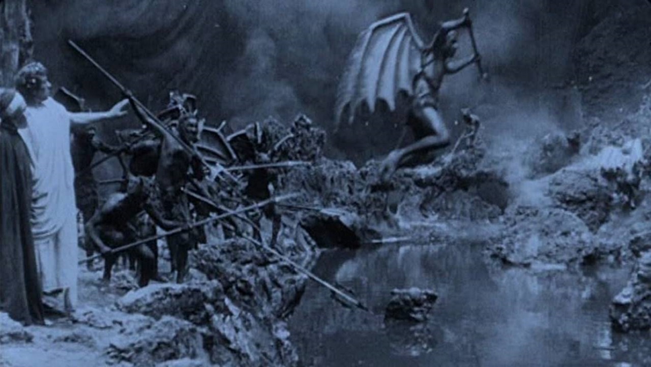 Demons torture damned souls in the rivers of pitch in Dante's Inferno (1911)