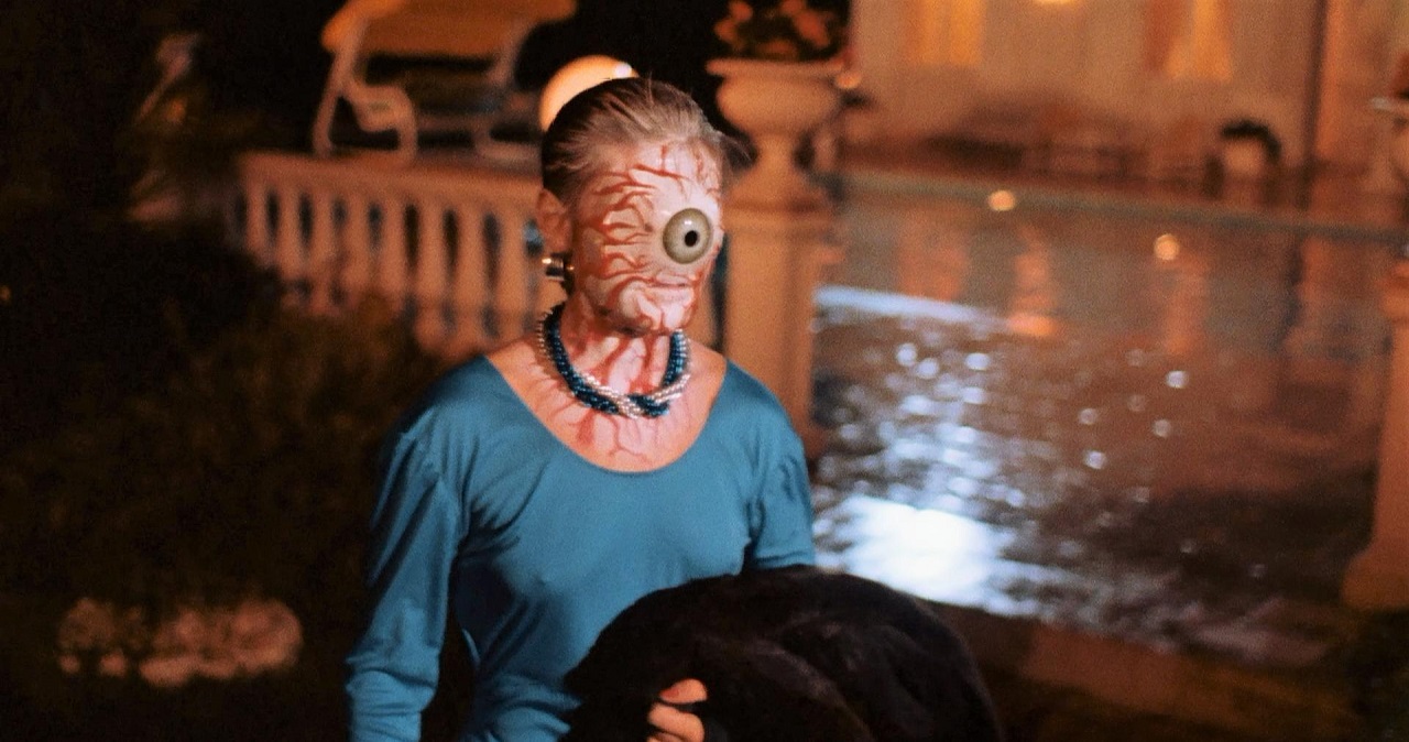 Katrine Michelsen with eyeball head in Delirium (1987)