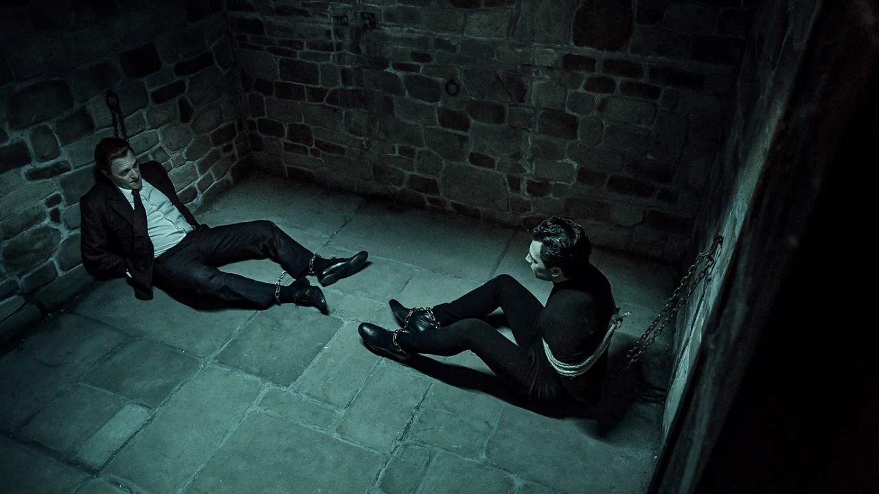 Inspector Ginko (Valerio Mastandrea) and Diabolik (Giacomo Gianniotti) chained up in the cellar in Diabolik Chi Sei (2023)