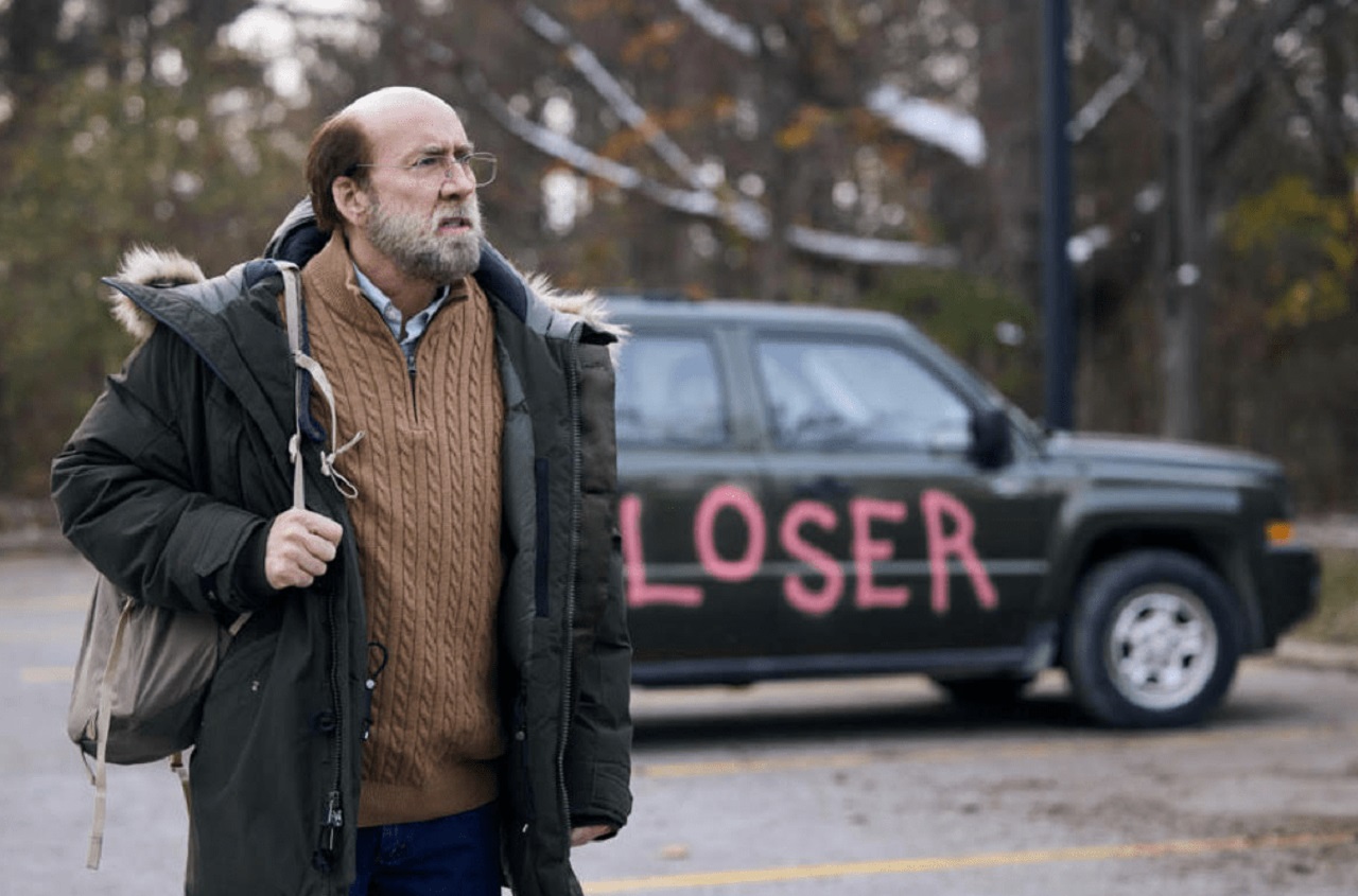 Paul Matthews (Nicolas Cage) with loser graffitied on his vehicle in Dream Scenario (2023)