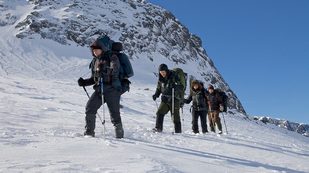 Holly Goss leads a group of filmmakers up the mountainside in The Dyatlov Pass Incident (2013)