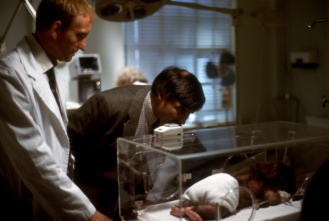 Charles Dance and Peter Tilbury in First Born (1988)