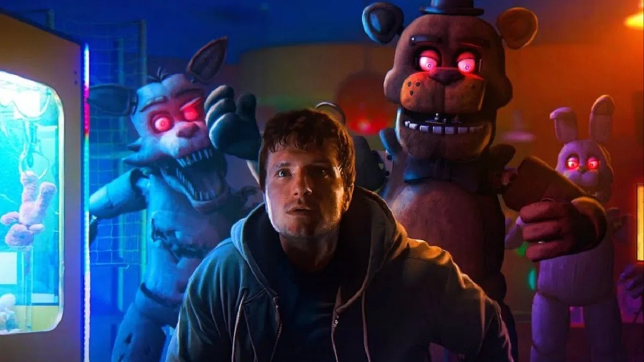 Mike (Josh Hutcherson) surrounded by the evil animatronics in Five Nights at Freddy's (2023)