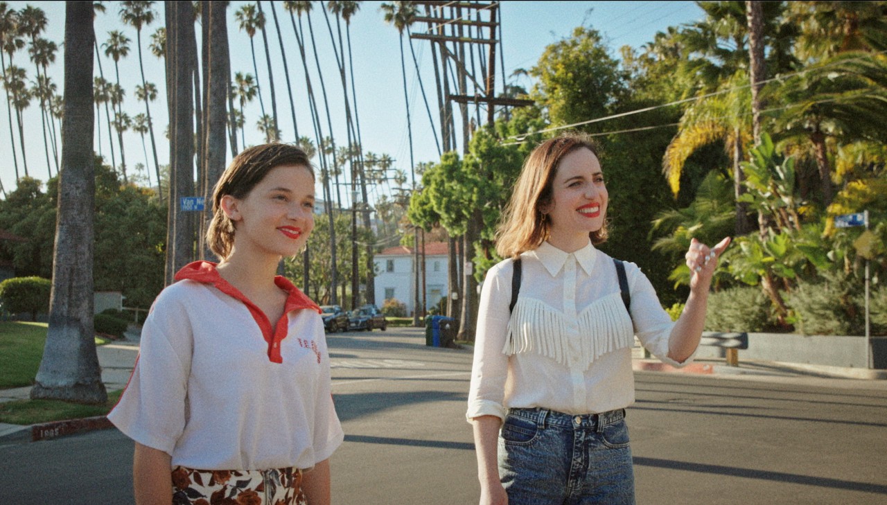 Zoe Lister Jones and her Young Self (Cailee Spaeny) in How It Ends (2021)
