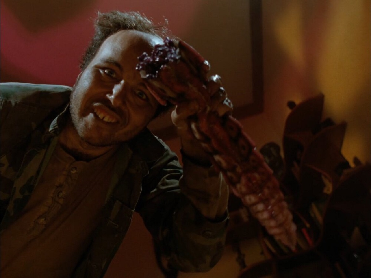 Homeless man Clint Howard with one of the bugs in Initiation: Silent Night Deadly Night 4 (1990)