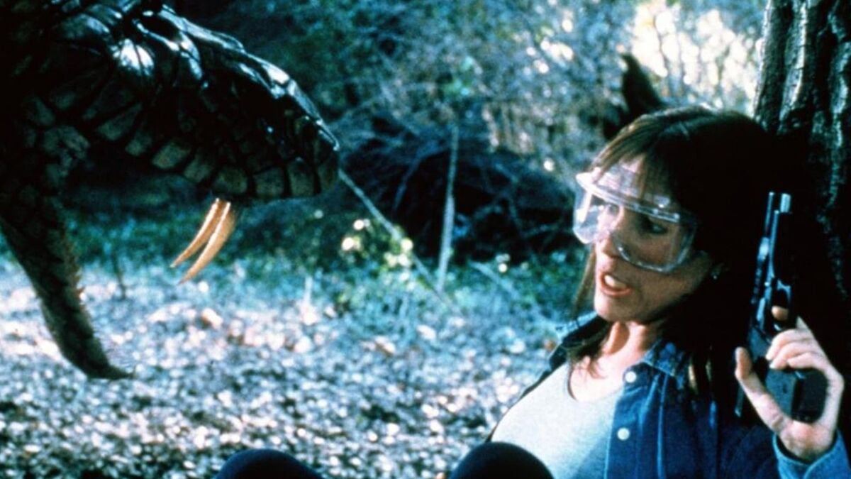 Casey Fallo and giant snake in King Cobra (1999)