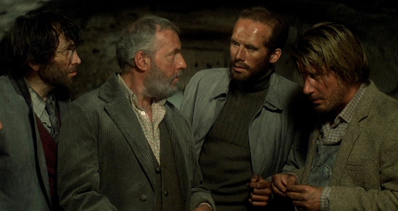 Robert Dhery, Michel Serrault, Hanns Zischler and Jacques Dutronc in Malevil (1981)