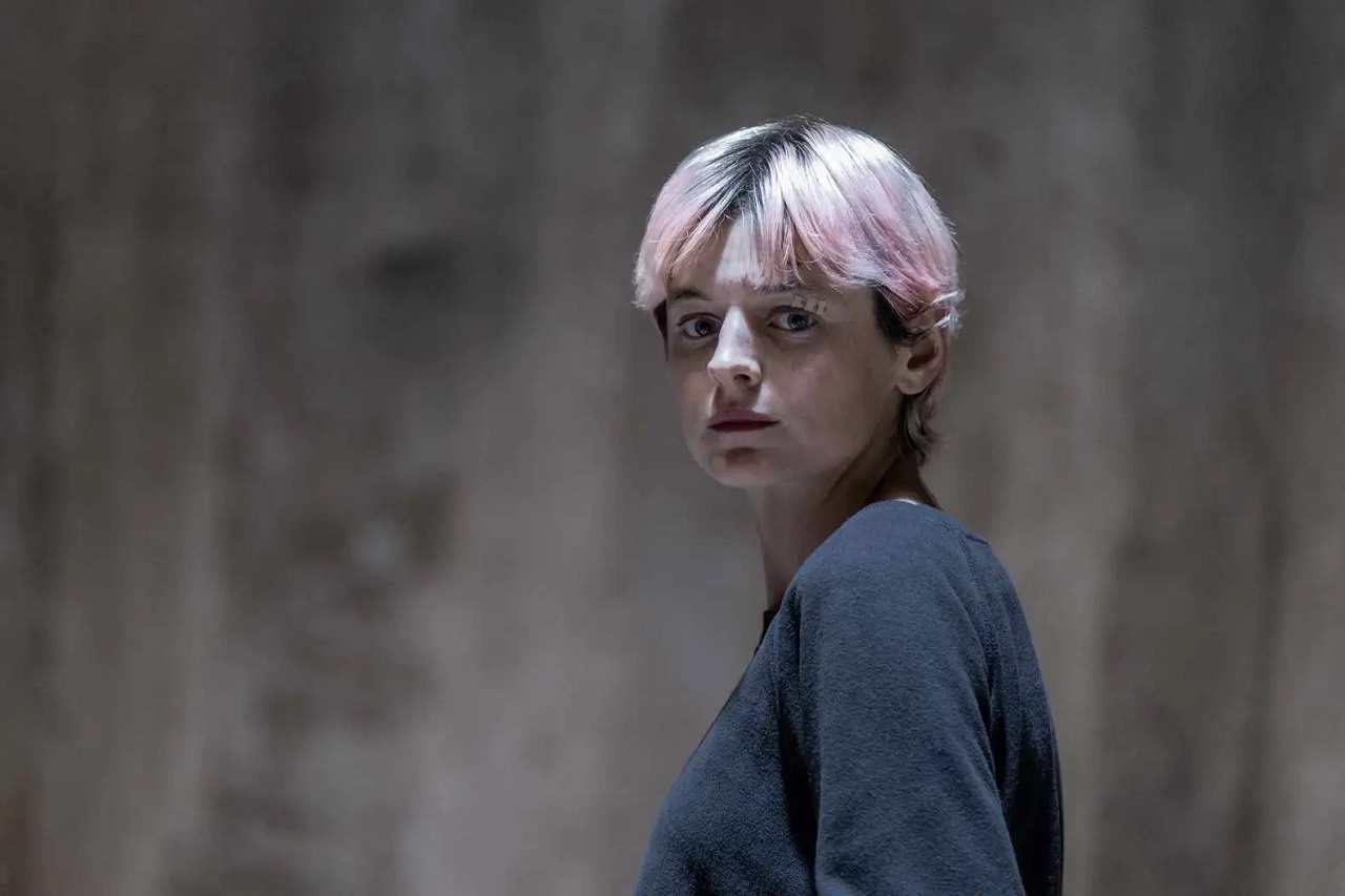 Emma Corrin as Darby Hart in A Murder at the End of the World (2023)