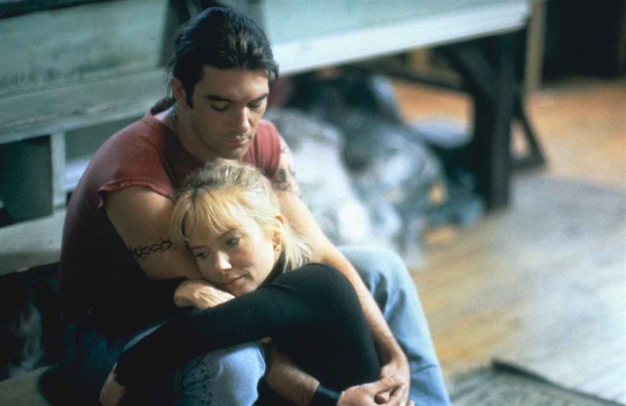 Antonio Banderas and Rebecca De Mornay in Never Talk to Strangers (1995)
