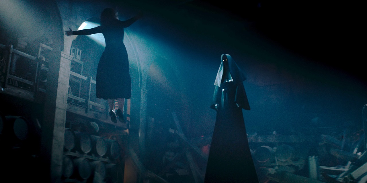 Sister Irene (Taissa Farmiga) is levitated by The Nun (Bonnie Aarons) in The Nun II (2023)
