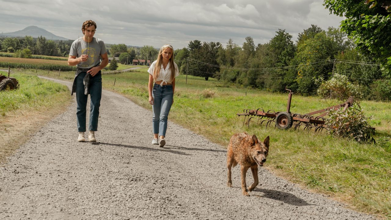 Jackson White and Natalie Alyn Lind follow the Baterman dog home in Pet Sematary: Bloodlines (2023)