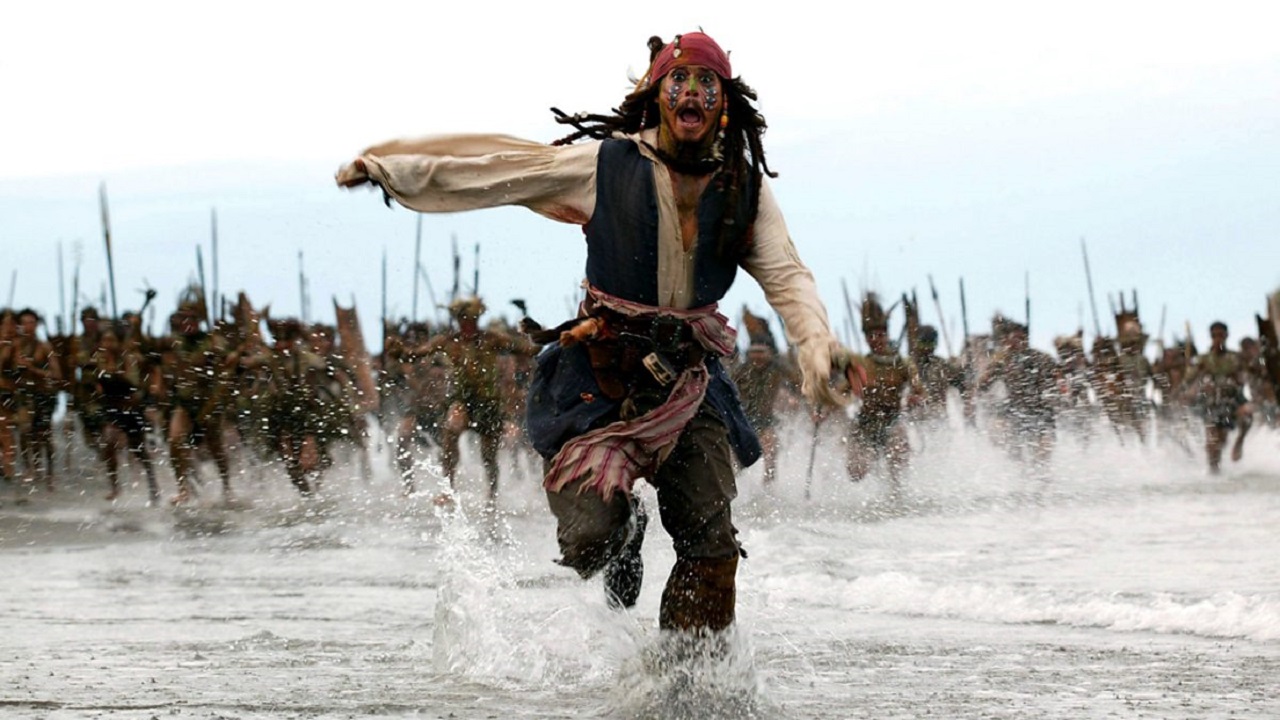 Captain Jack Sparrow (Johnny Depp) flees from cannibals in Pirates of the Caribbean: Dead Man’s Chest (2006)
