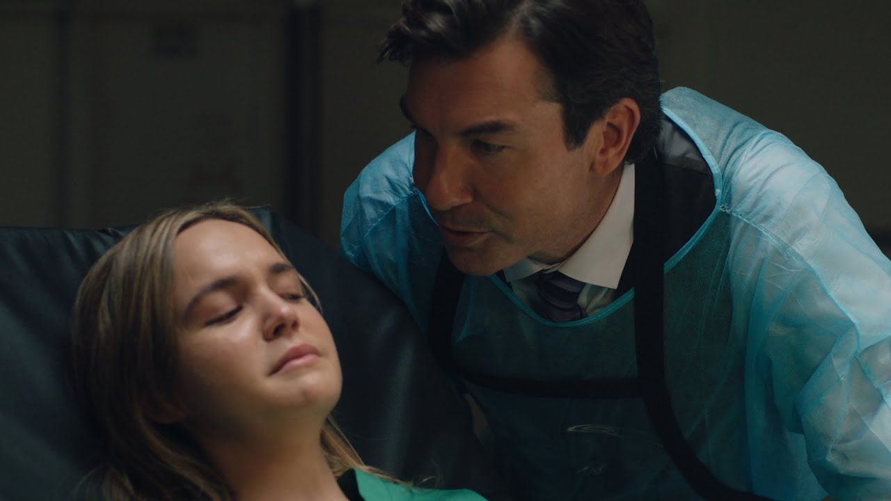 Bailee Madison menaced by The Coroner (Jerry O'Connell) in Play Dead (2022)